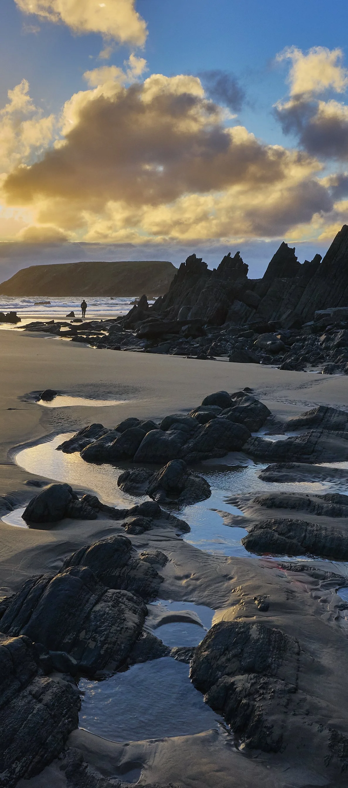 Photographer on beach at dusk