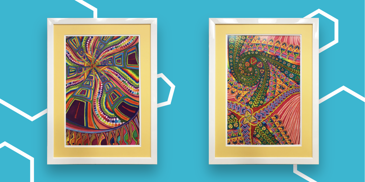Two colorful abstract paintings in white frames with yellow mats hanging on a blue wall.