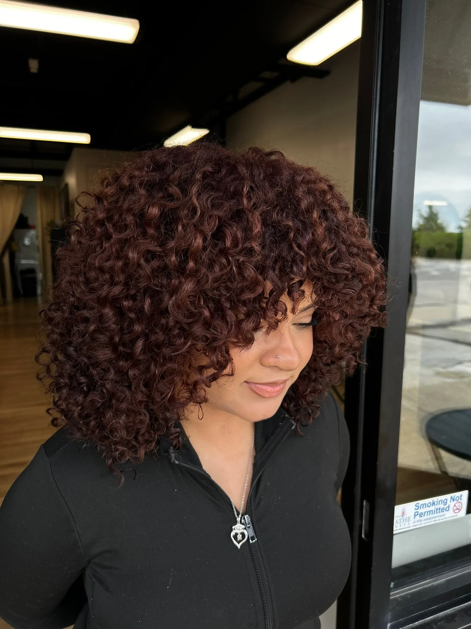 How to Reduce Frizz Without Weighing Down Your Curls