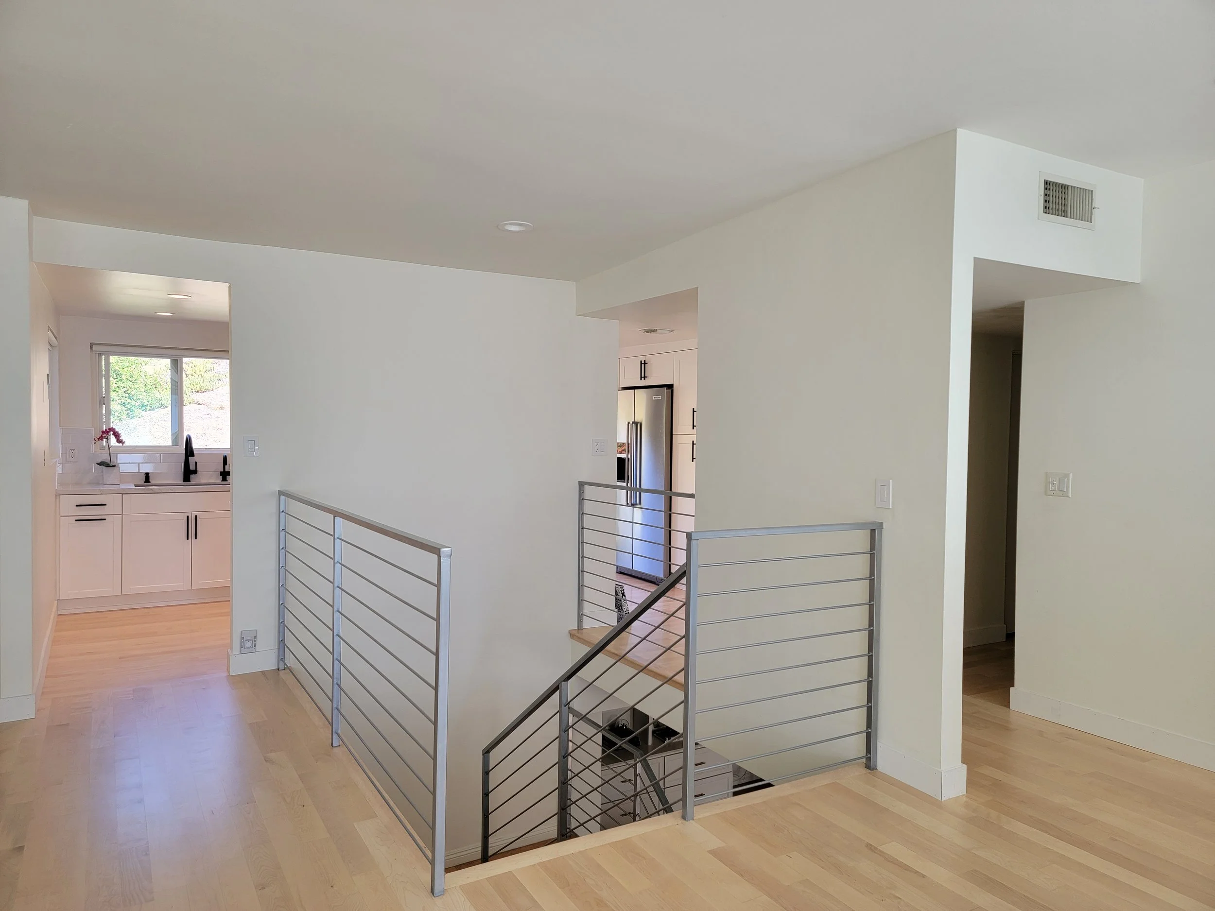 Open floor plan design with new railing