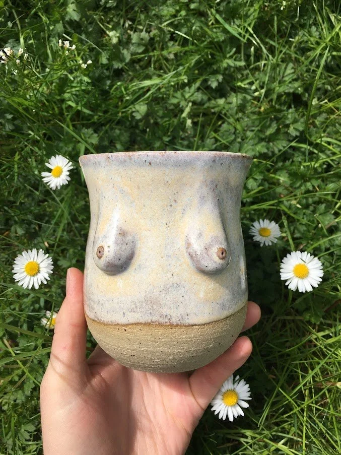 Boob mug in daisies.JPG