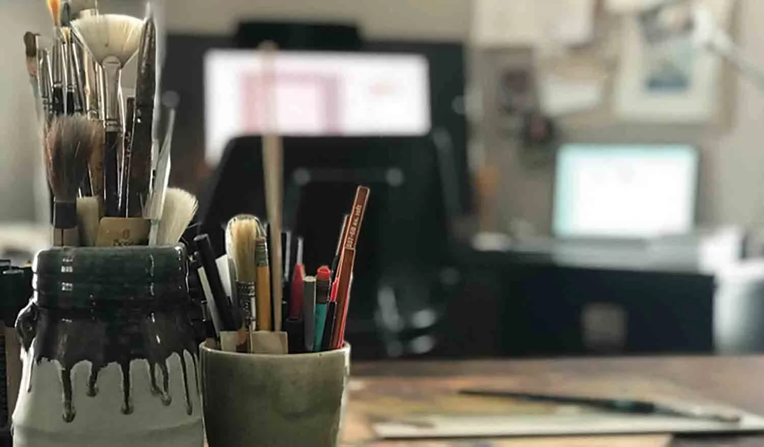 Studio photo: Stephanie Beischer’s illustration studio with paintbrushes and art desk