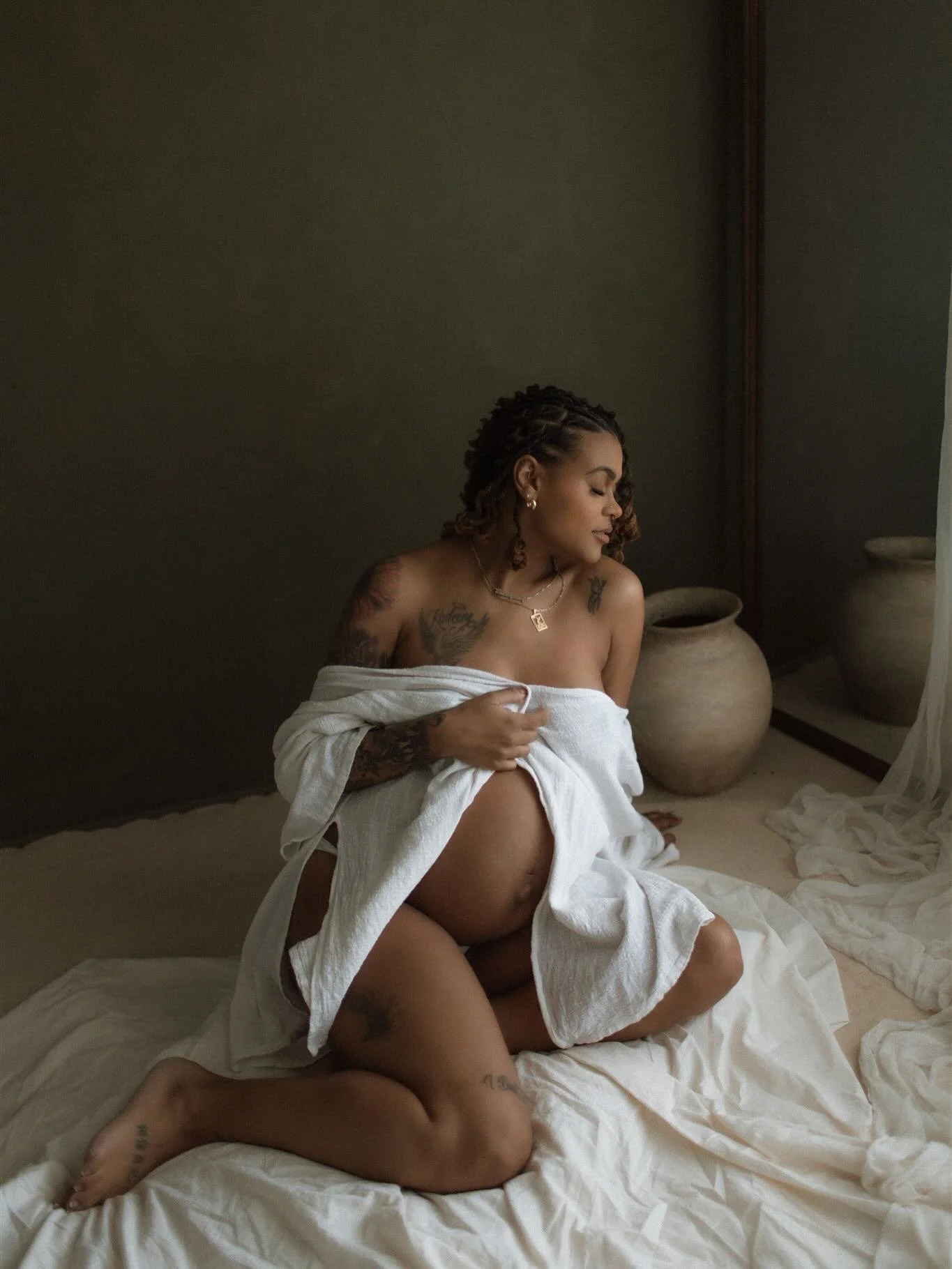 In my studio, I&rsquo;m drawn to the darker softness of it all &mdash; the texture, the quiet, the romance, the way motherhood can feel both powerful and tender. 

I love creating maternity images that feel intimate and artful, effortless in the way 