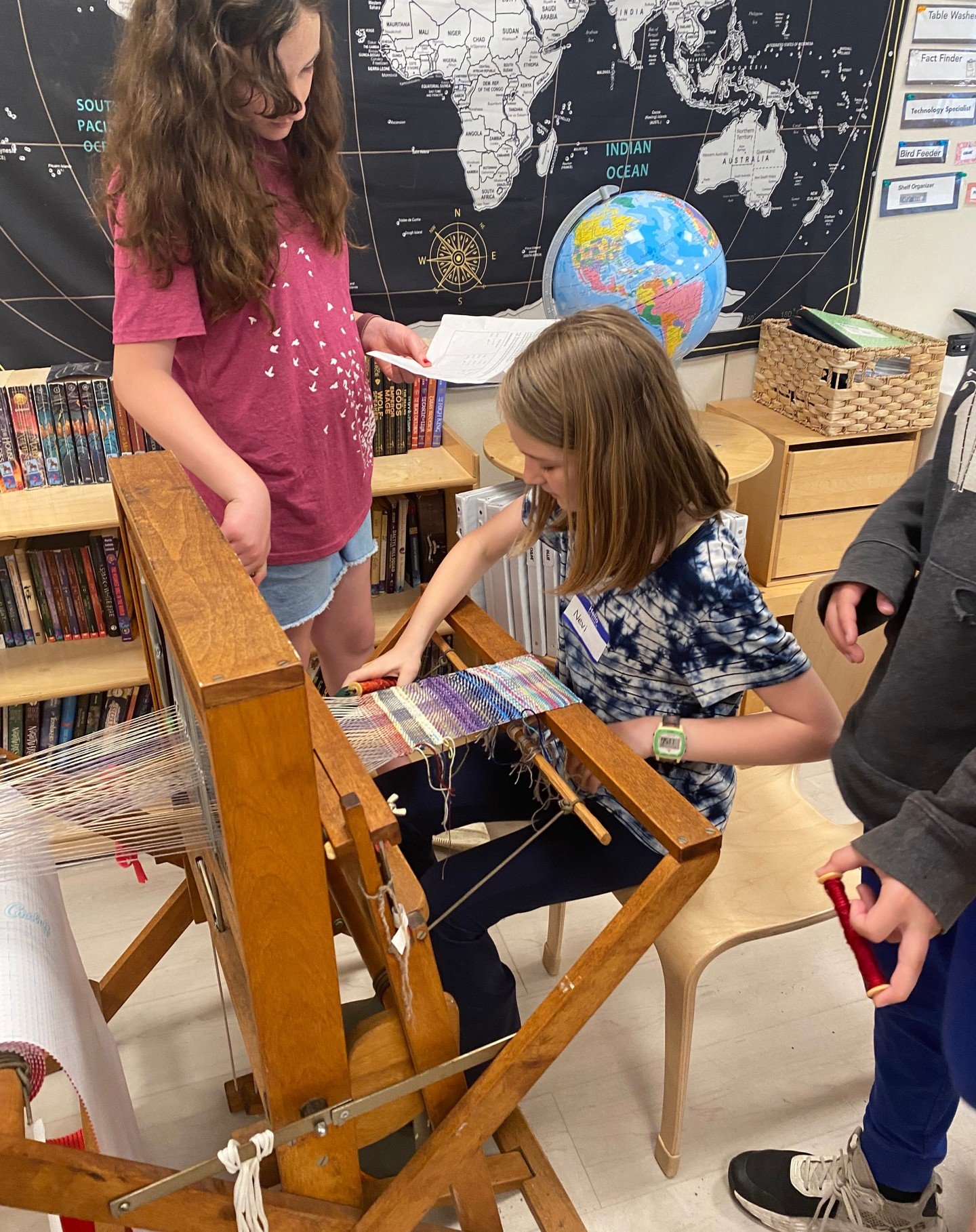 The 4-5 class launched their study of the Industrial Revolution with a workshop led by fiber artist Krysten Morganti. Students learned how to use the spinning wheel to make their own yarn and wove collaborative pieces on three different looms. What a