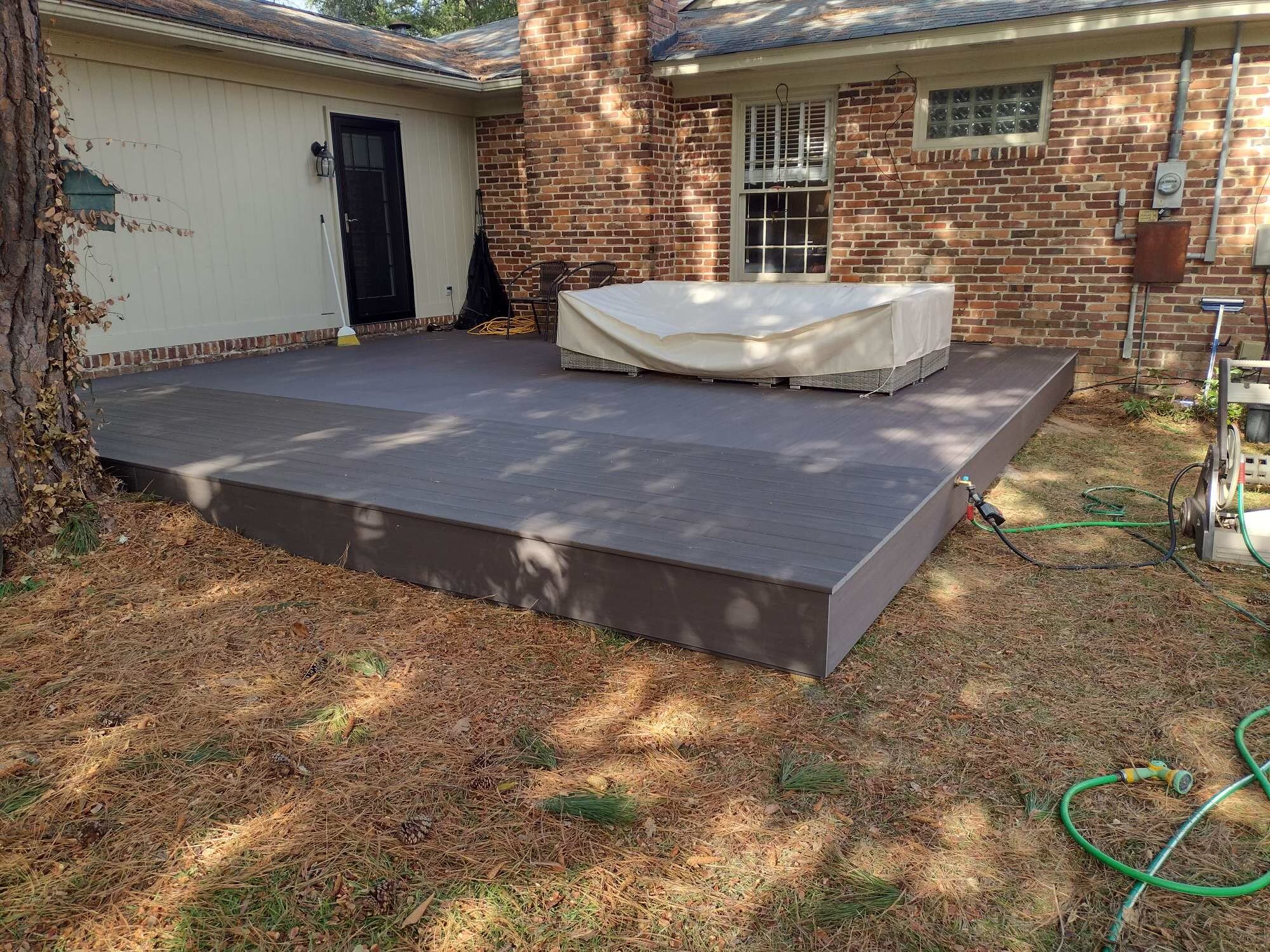 Synthetic decking start for enclosed porch
