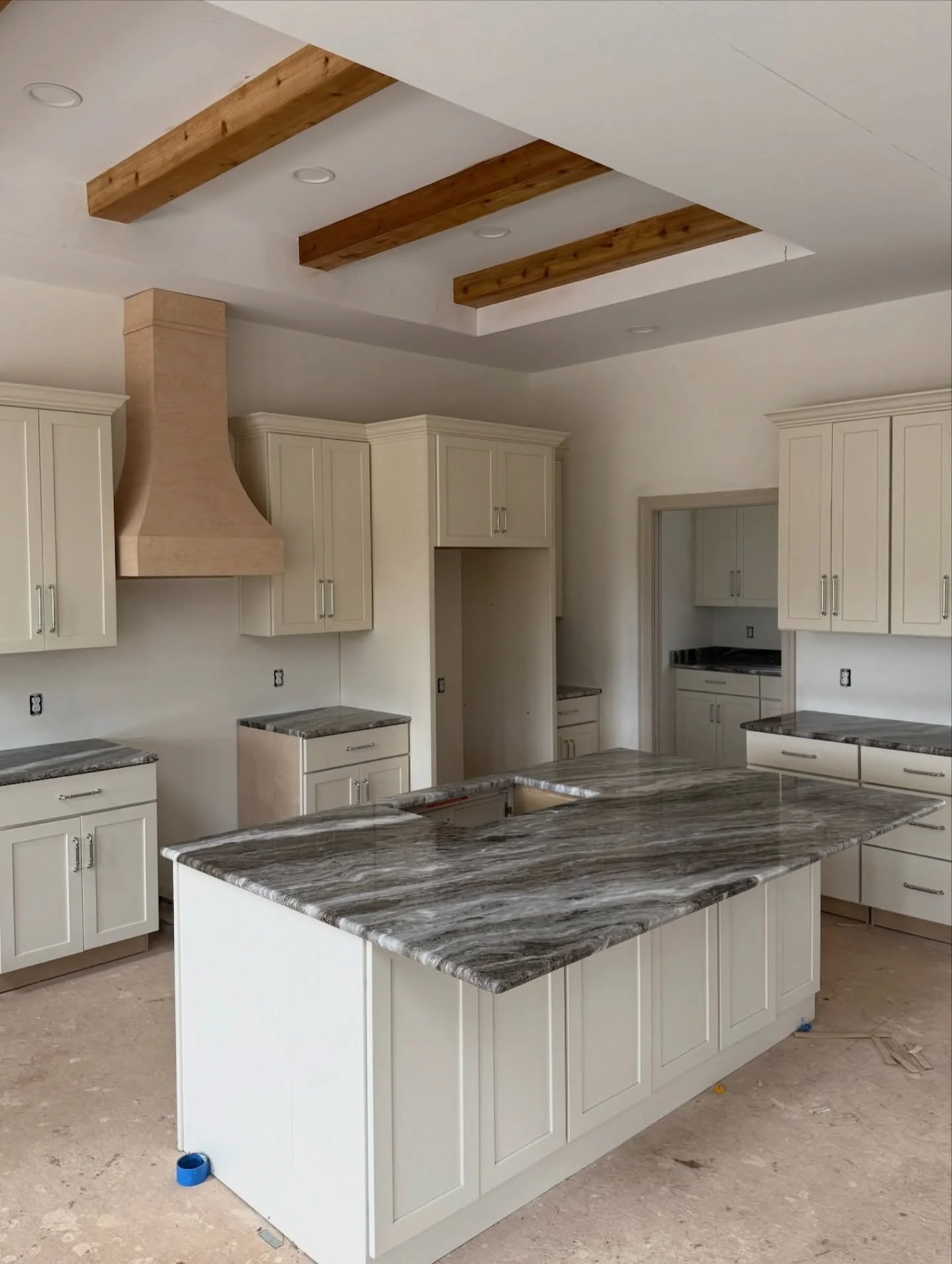 The best part of progress shots? Seeing the vision take shape piece by piece. These clean white cabinets with wood accents and fresh hardware are just the beginning of this dream kitchen! Follow along @frankgoodbuilders to see this beauty come to lif