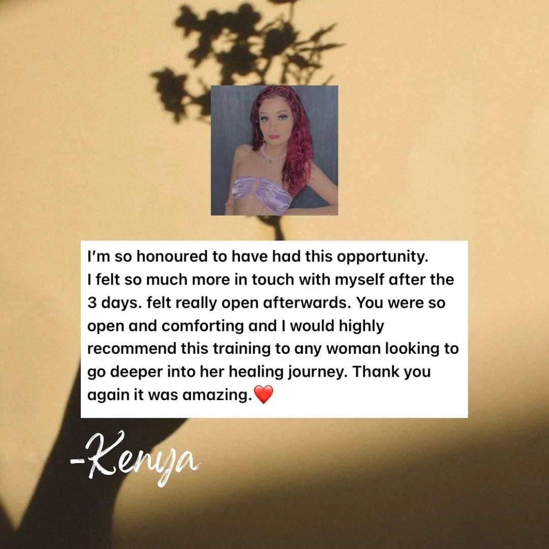 A shadow of a flower on a yellow wall with a photograph of a woman with red hair, wearing a purple strapless top, and a handwritten note. The note expresses gratitude for a healing or wellness training, praising its impact and recommending it to othe