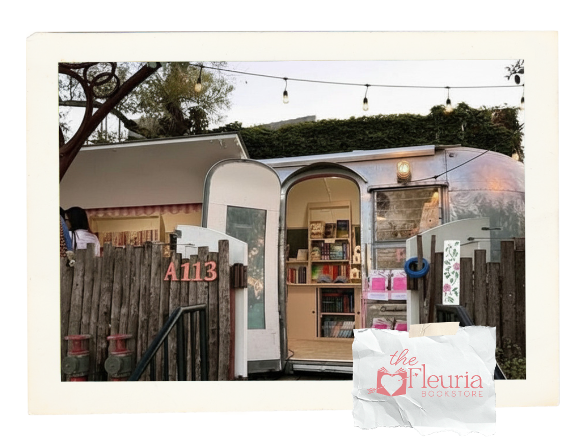 The Fleuria logo and airstream trailer with books