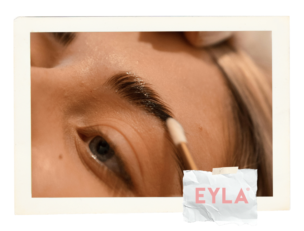 EYLA logo and a blonde woman receiving eyebrow lamination in a beauty salon