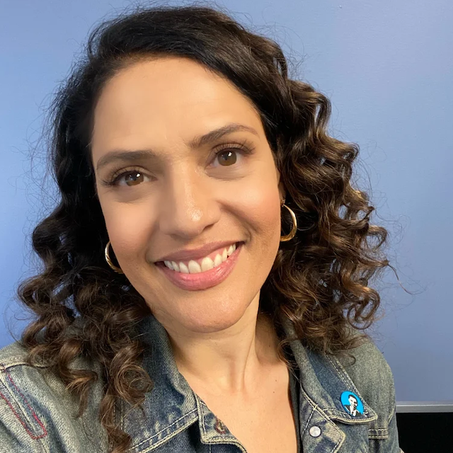 Donor organizer Monique Gabriela Curnen smiles at the camera