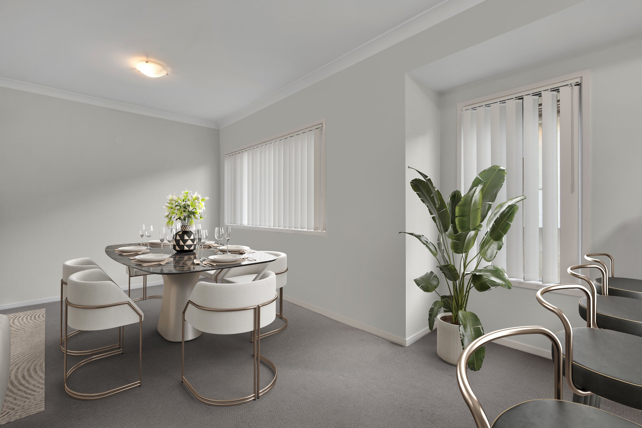 Modern dining room with a round table set with white plates and glasses, surrounded by white chairs with gold accents, a large potted plant near a window with vertical blinds, and a gray carpeted floor.