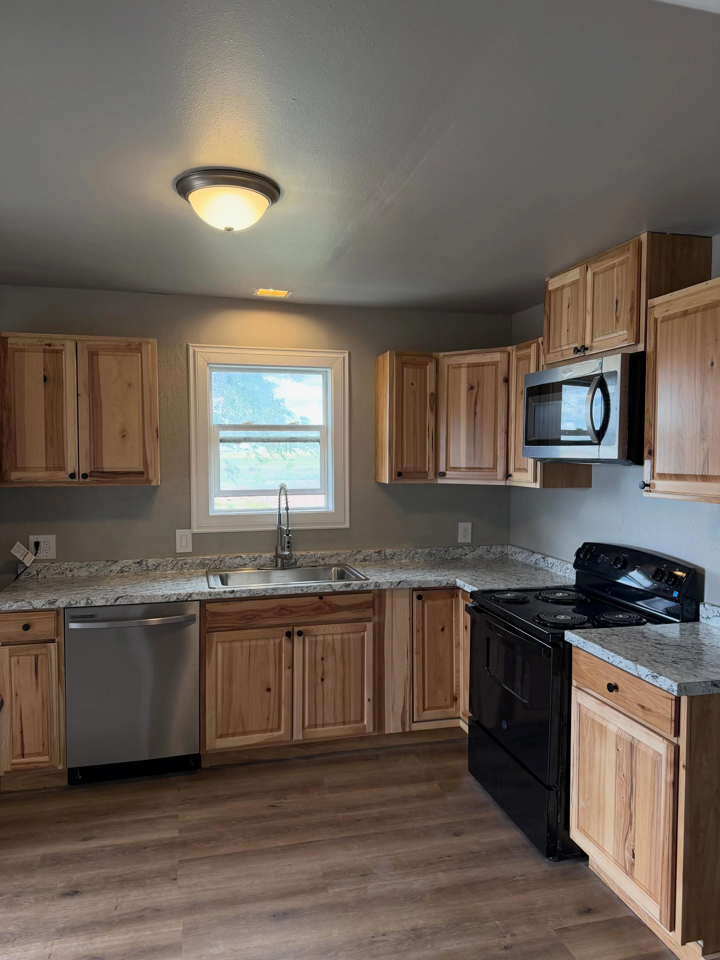 All done! I&rsquo;m calling this one the Farmhouse Flip. The name of the game was to get this house remodeled and livable as quickly as possible. What started as a kitchen and bath remodel, a little flooring, and an interior paint job ended up being 