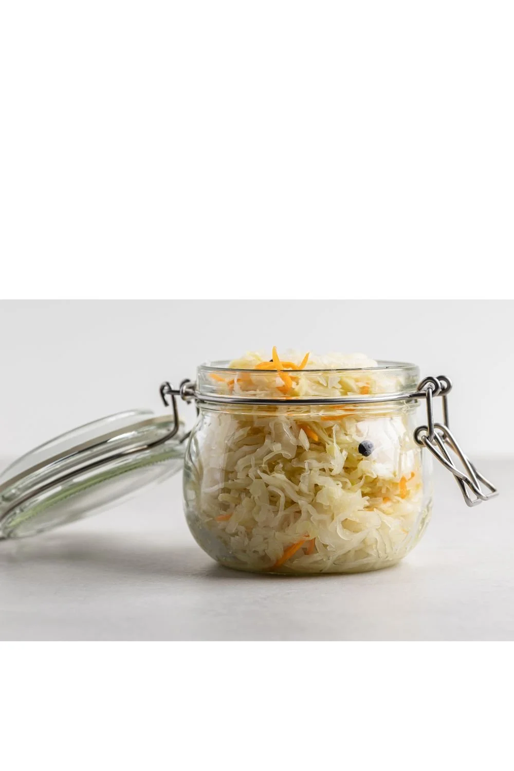 Homemade sauerkraut fermenting in a glass jar
