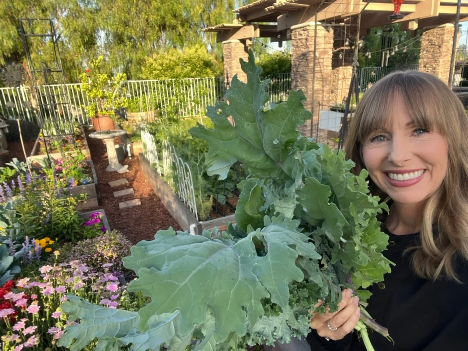 Michelle from Green Food Crush outdoors in her garden sharing simple ways to start living healthier.