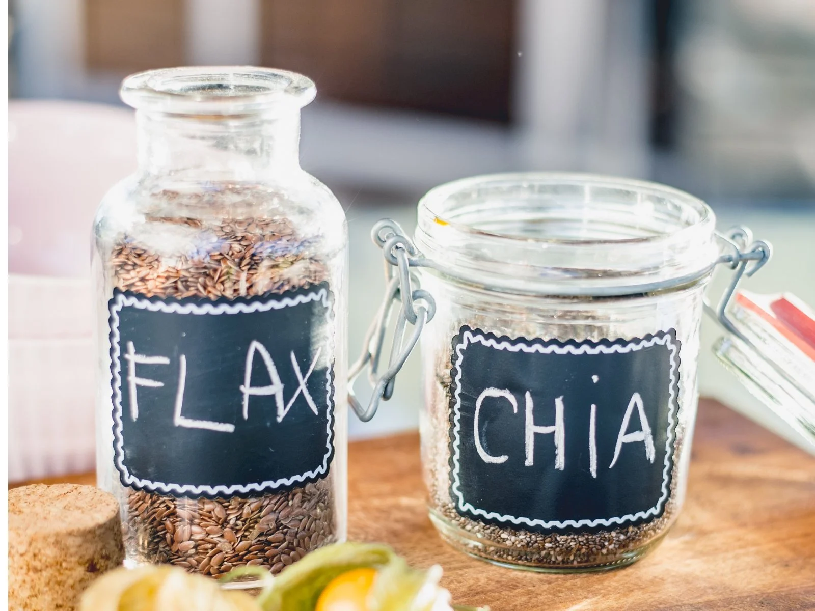 Flax and chia seeds in labeled glass jars for Dr. Brooke Goldner's Omega 3's protocol on GAIP