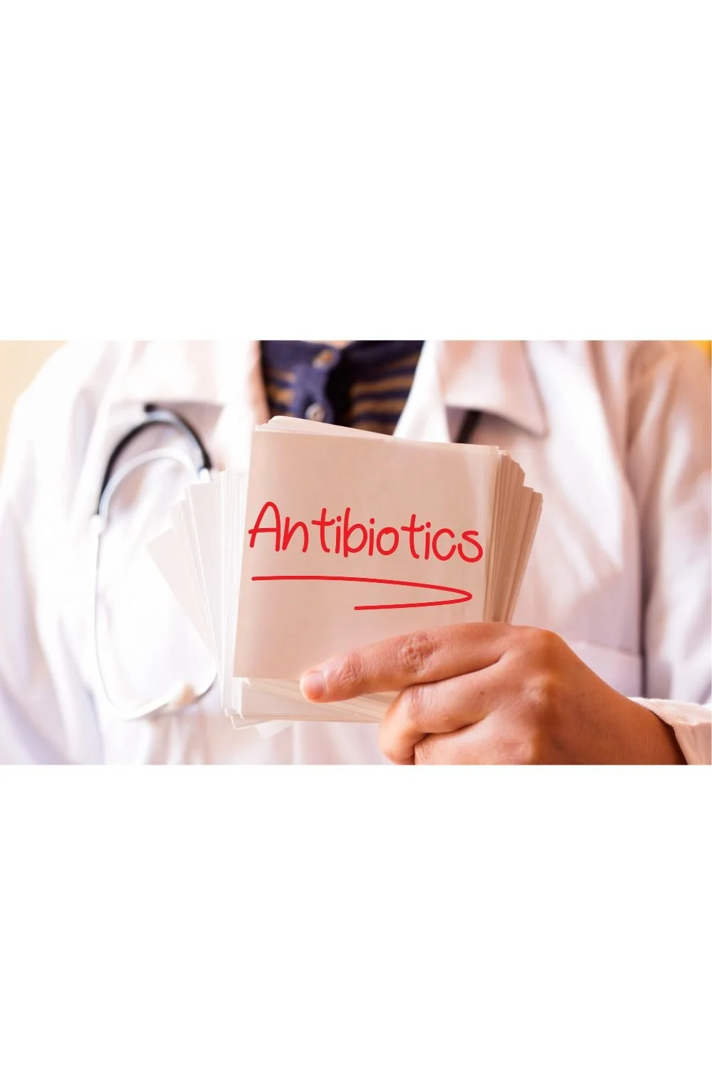 Healthcare professional holding a card reading antibiotics to illustrate their impact on the microbiome