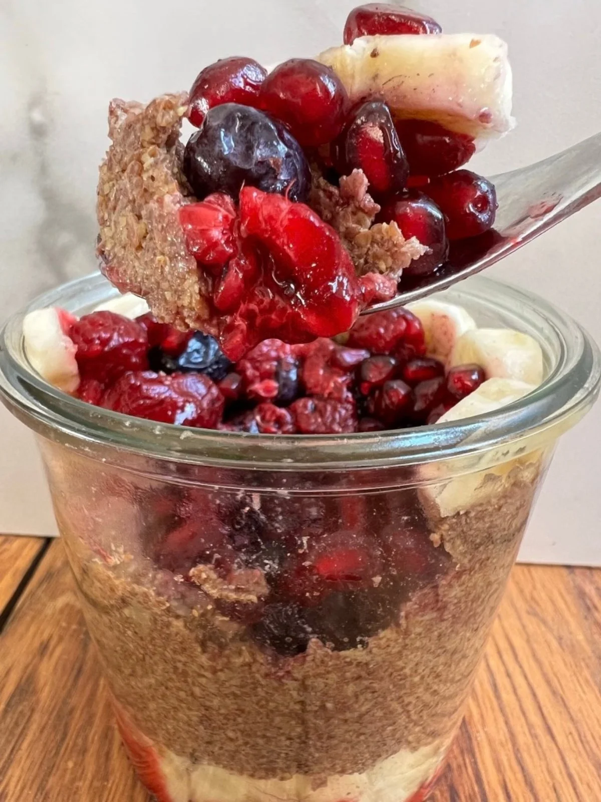 Fresh berries topped with ground flaxseed as a plant-based source of omega-3 ALA