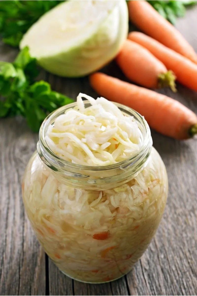 Homemade sauerkraut in a glass jar, a fermented food made from cabbage