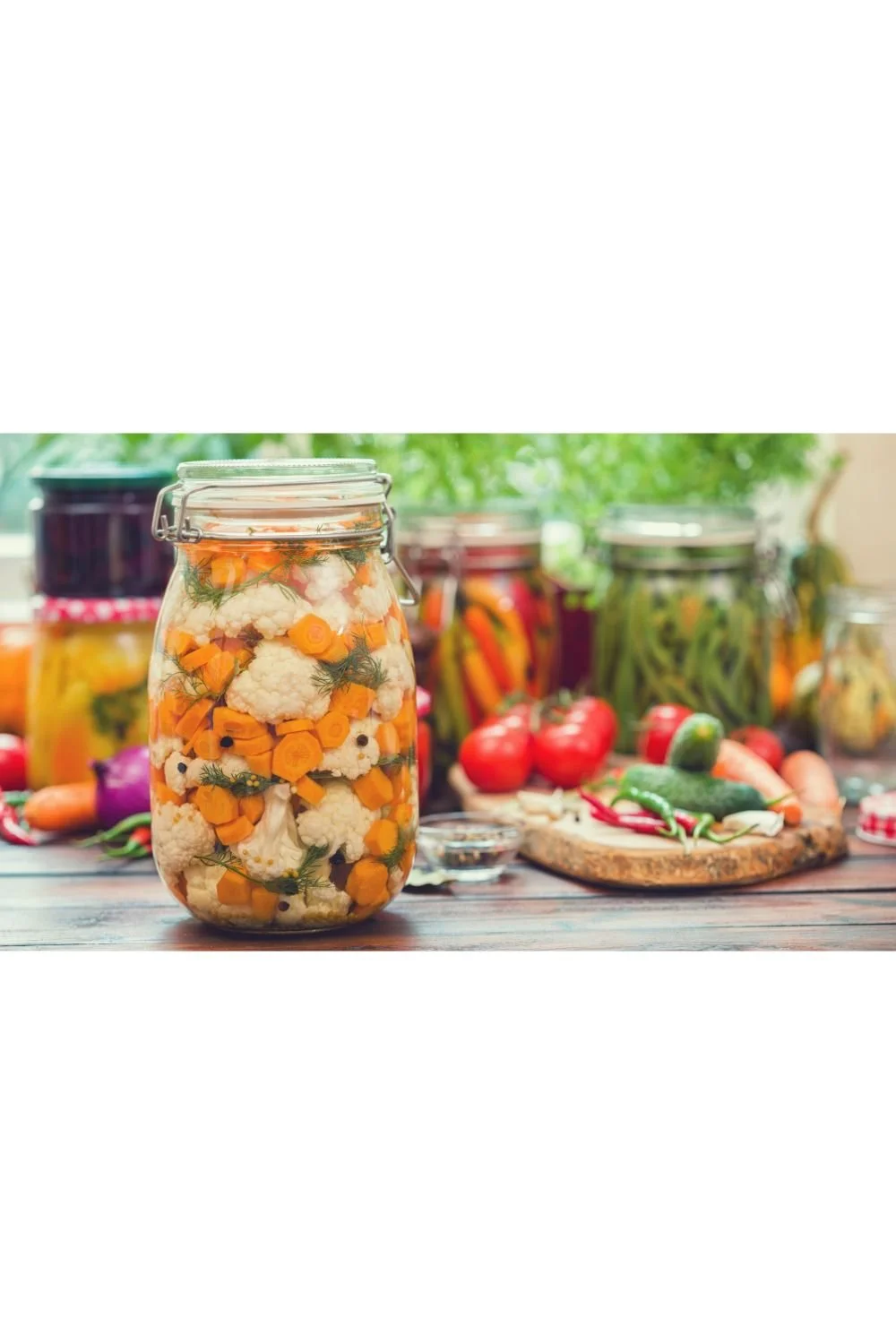 Homemade fermented cauliflower and carrots with fresh dill, peppercorns, red pepper flakes and bay leaf.