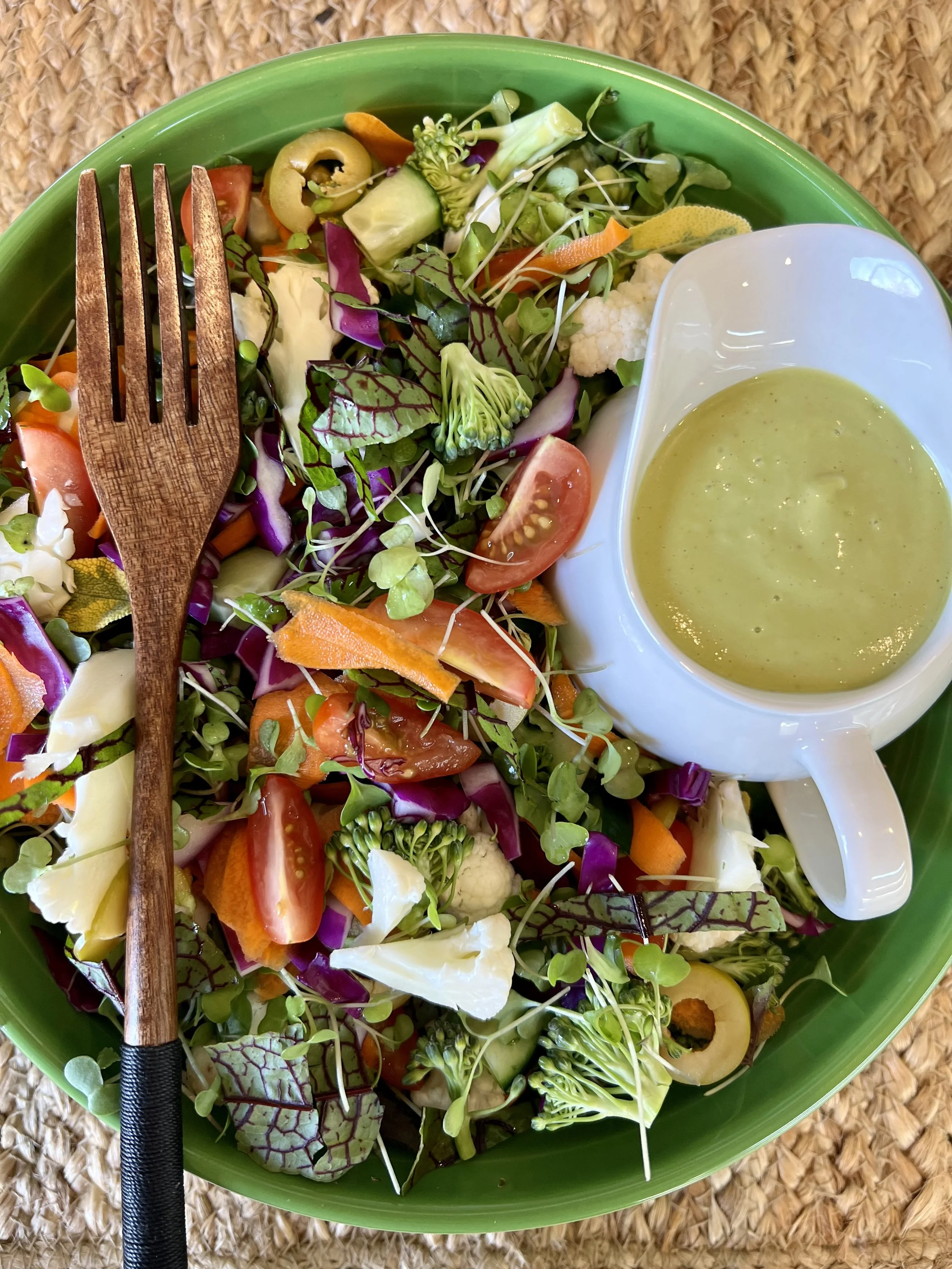 Colorful fiber-rich salad with vegetables and microgreens that nourish beneficial gut bacteria