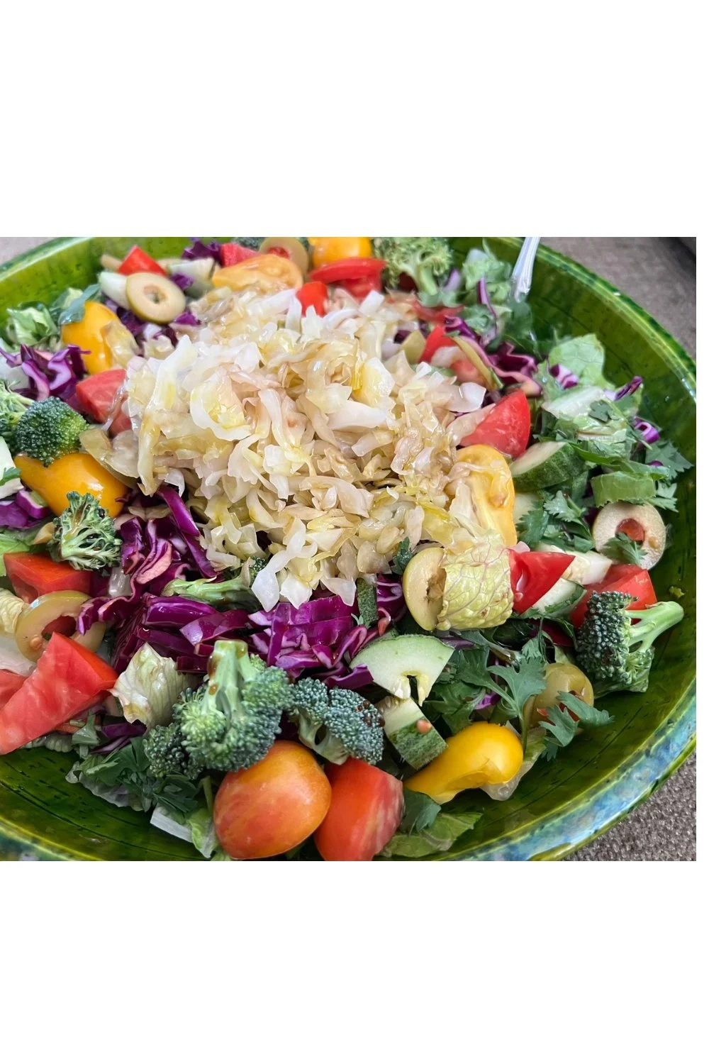 Rainbow salad with fermented sauerkraut supporting metabolic health and blood sugar balance.