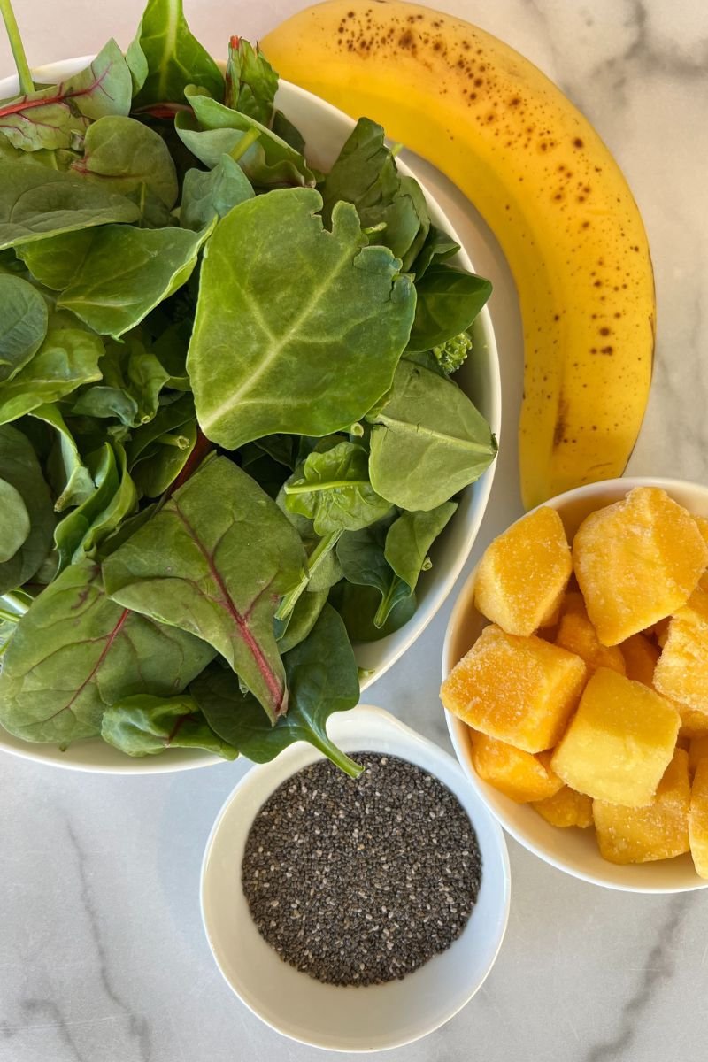 Leafy greens, frozen mango, and chia seeds for a hyper-nourishing green smoothie.