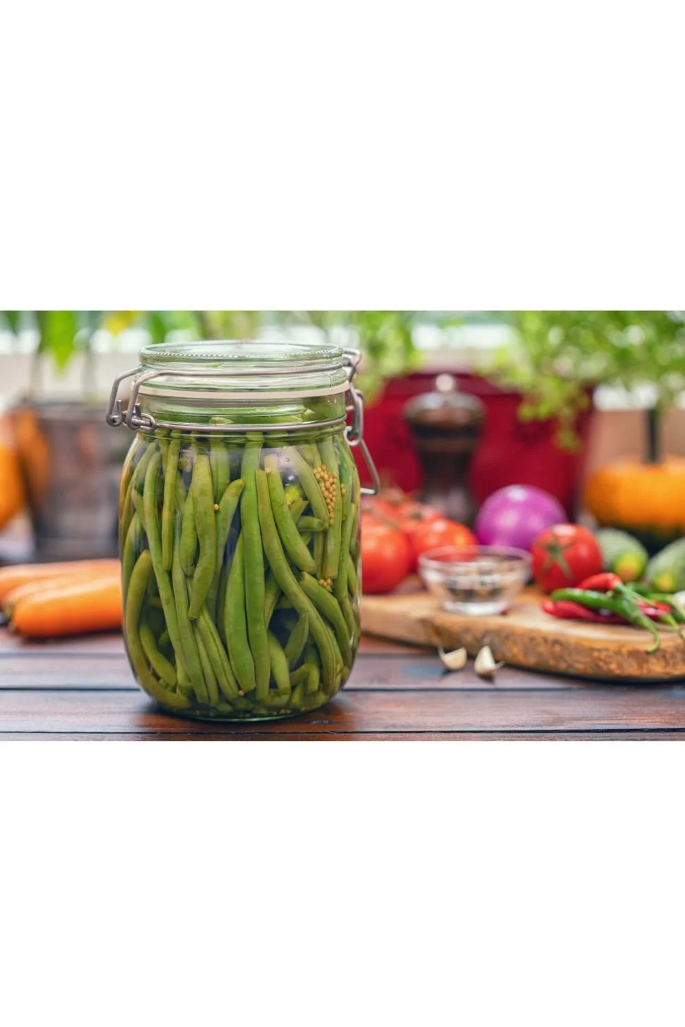 Homemade fermented dilly green beans with fresh dill, peppercorns, bay leaf and red pepper flakes.