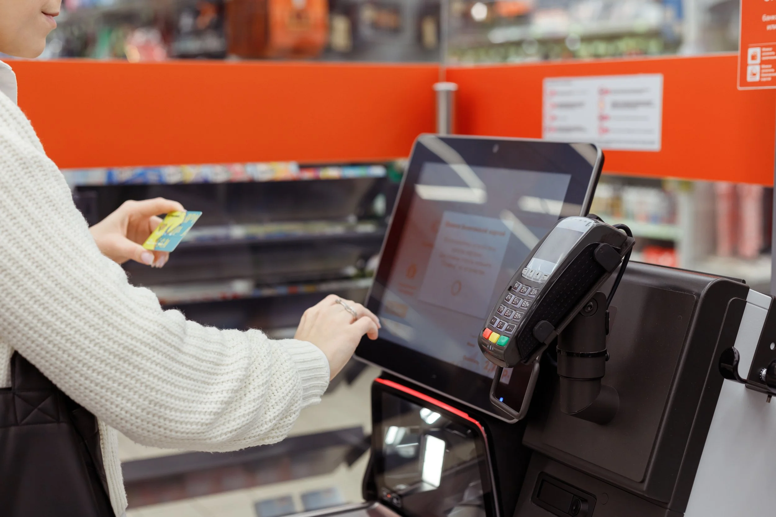 ustomer-woman-buys-and-pays-at-checkout-of-self-s-2022-11-23-21-44-08-utc.jpg