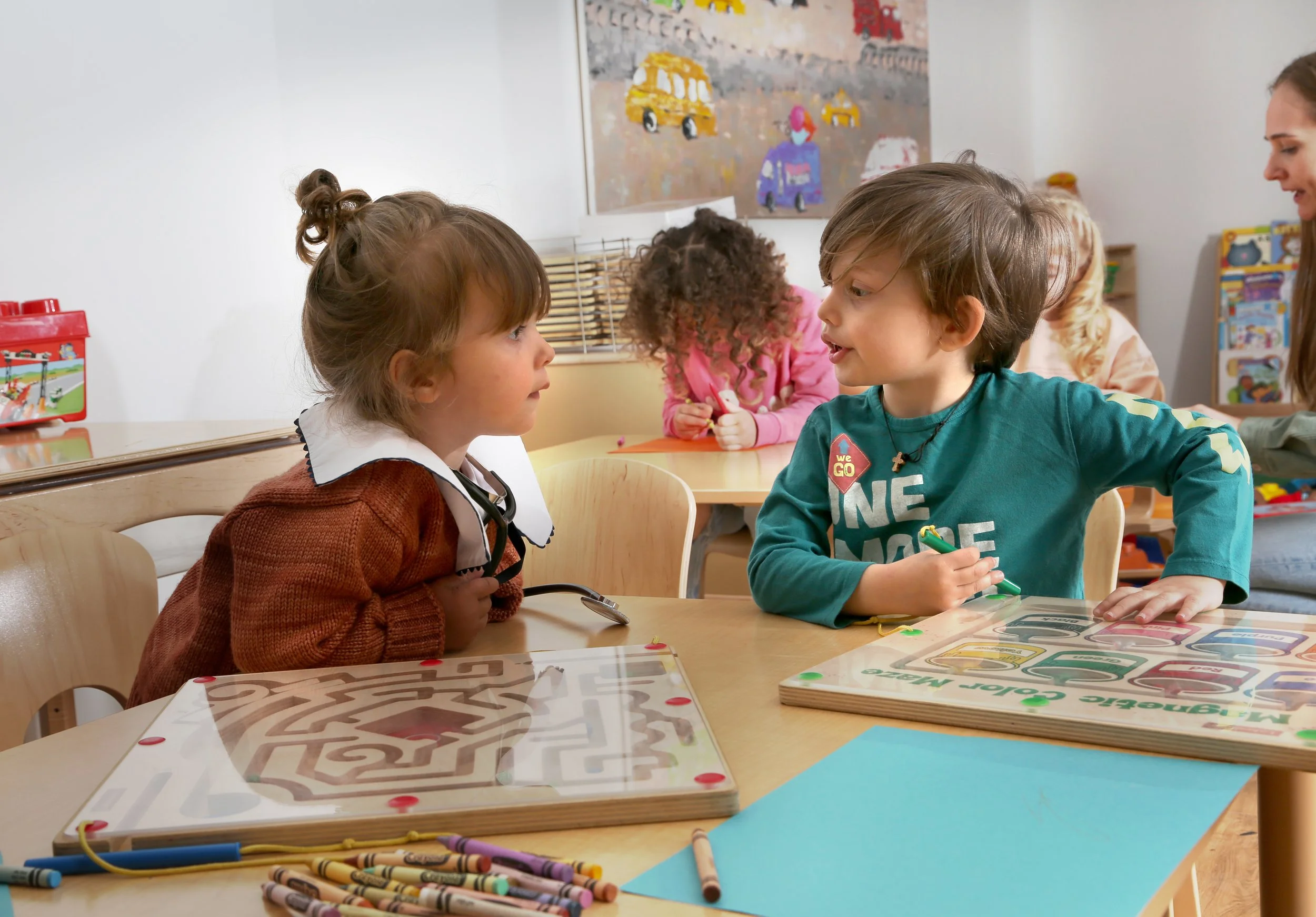 Children engaged in creative learning at Ladybug Preschool