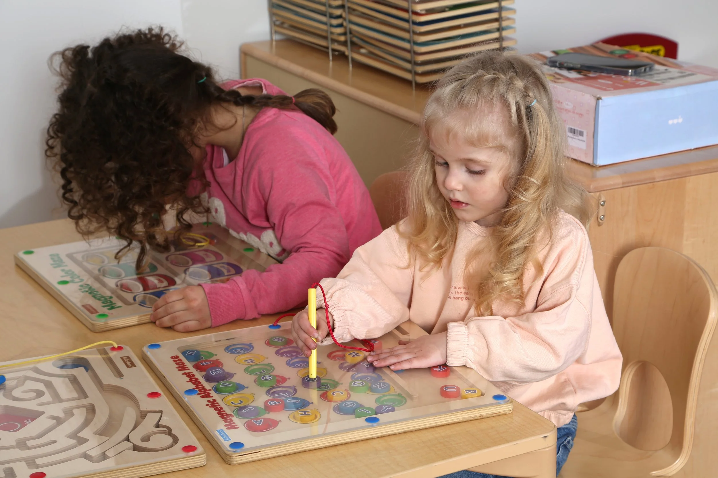 Preschool children doing hands-on learning at Ladybug Preschool, Brooklyn