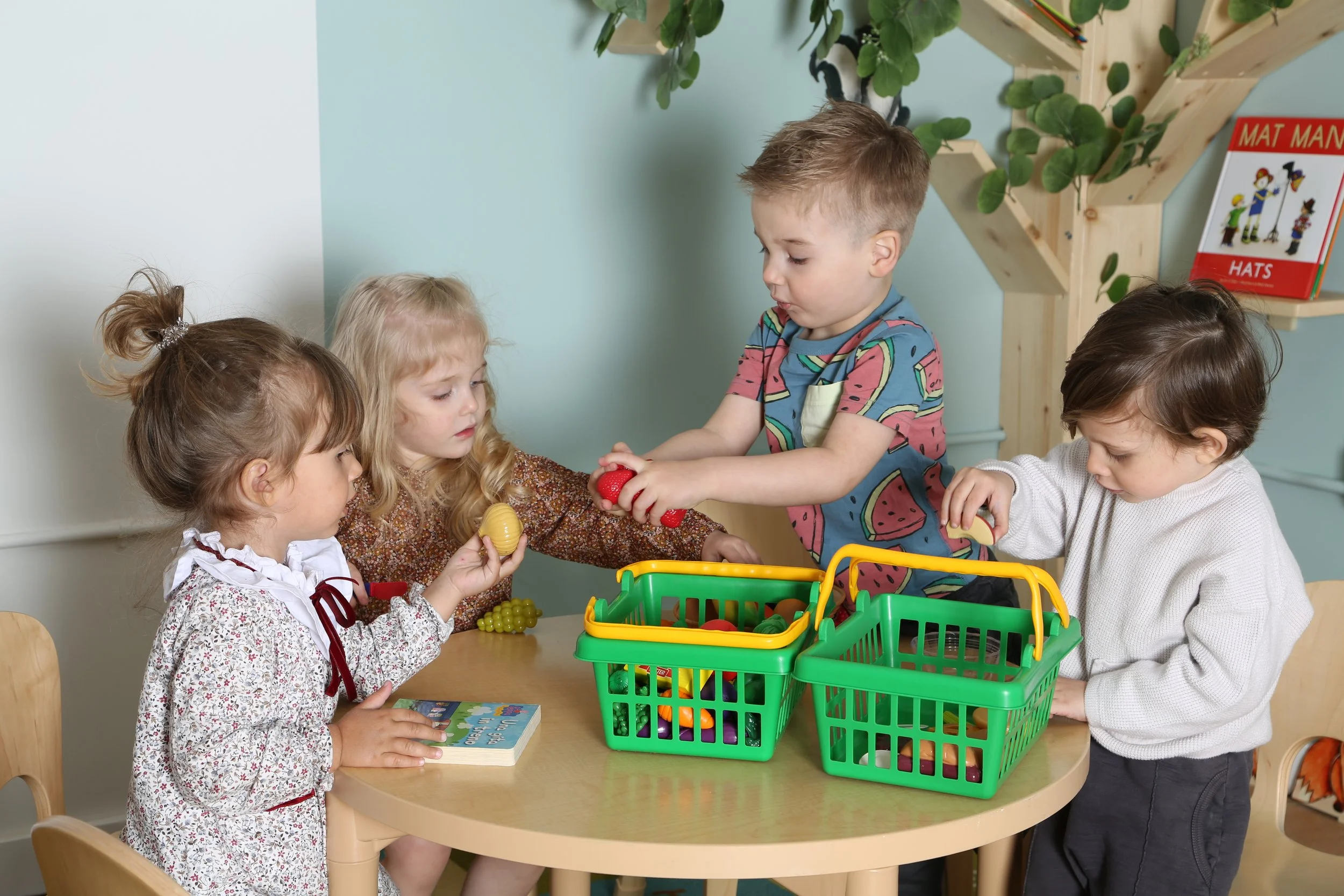 Children in a bright classroom at Ladybug Daycare, Carroll Gardens Brooklyn