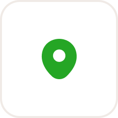 Green circular object with a hole in the center, on a black background.