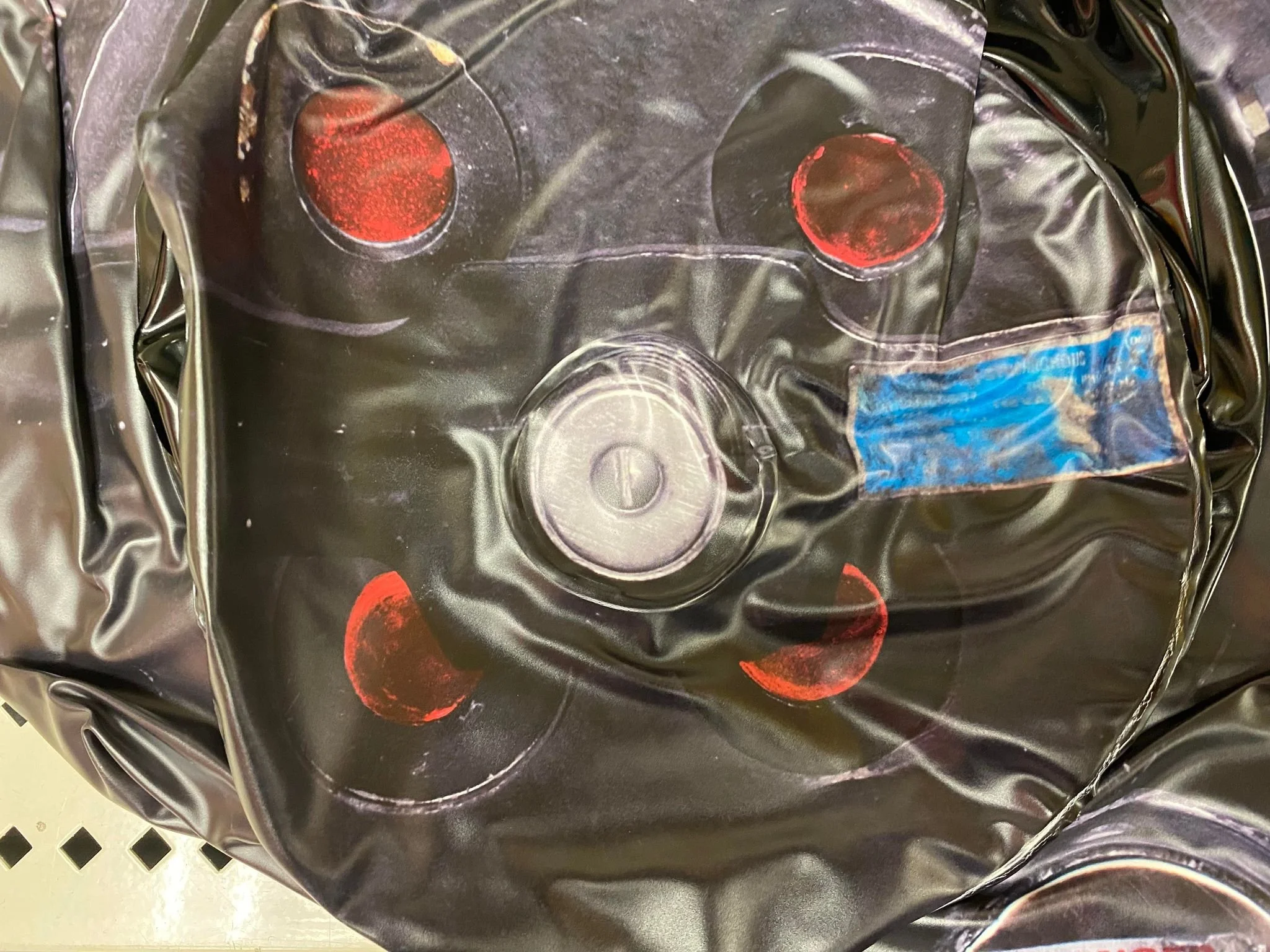 Detail of the GBA Stantz Hero Cyclotron and bumper label as seen on the inflatable proton pack from Disguise

