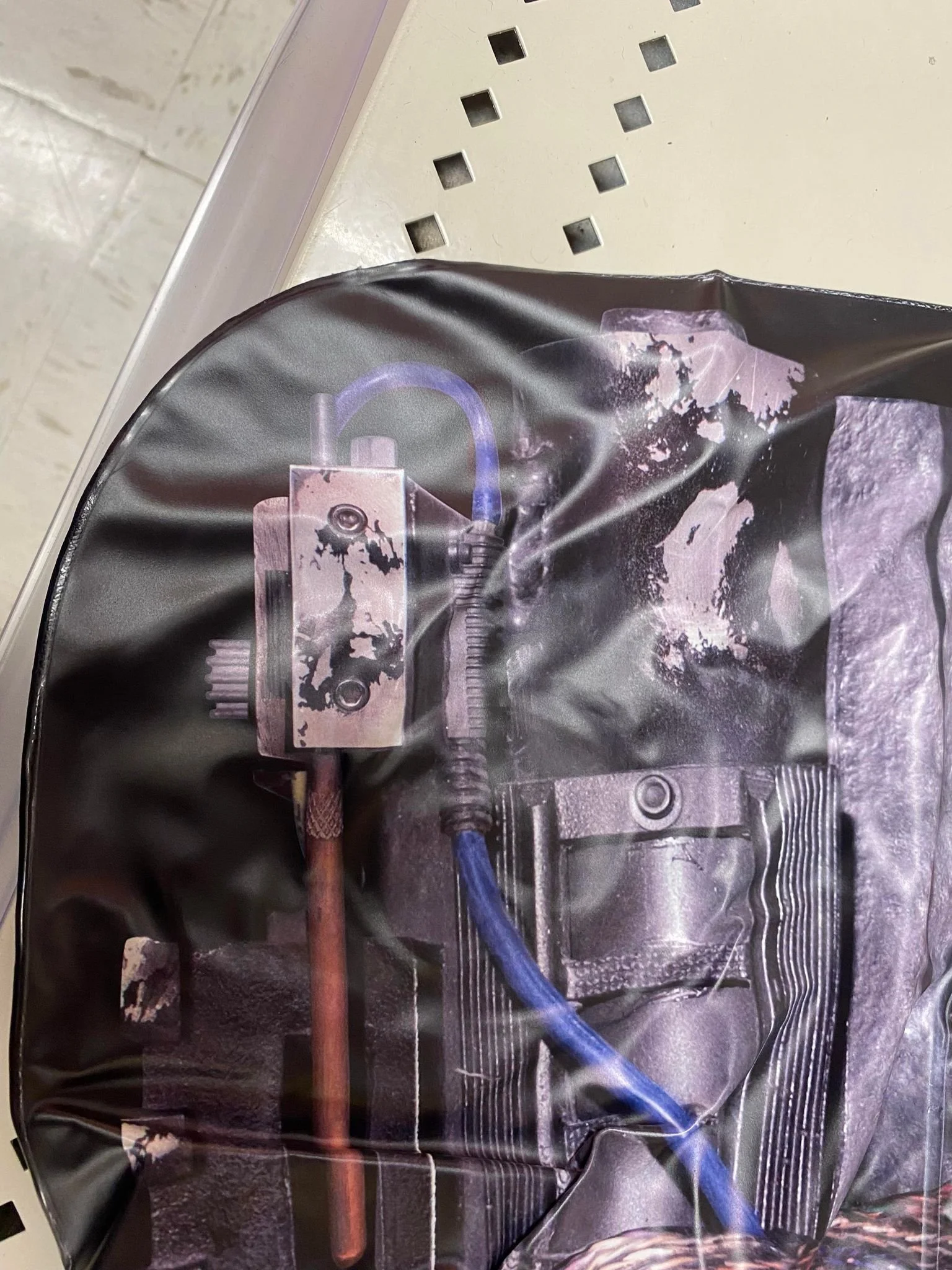 Detail of the GBA Stantz Hero Ion Arm Cap as seen on the inflatable proton pack from Disguise
