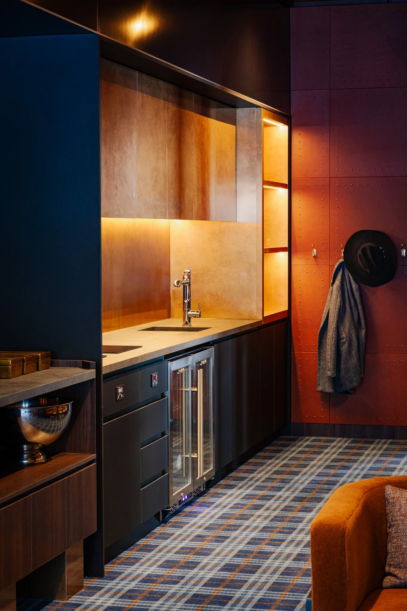 Kitchenette and plain carpet in a sports stadium private lounge
