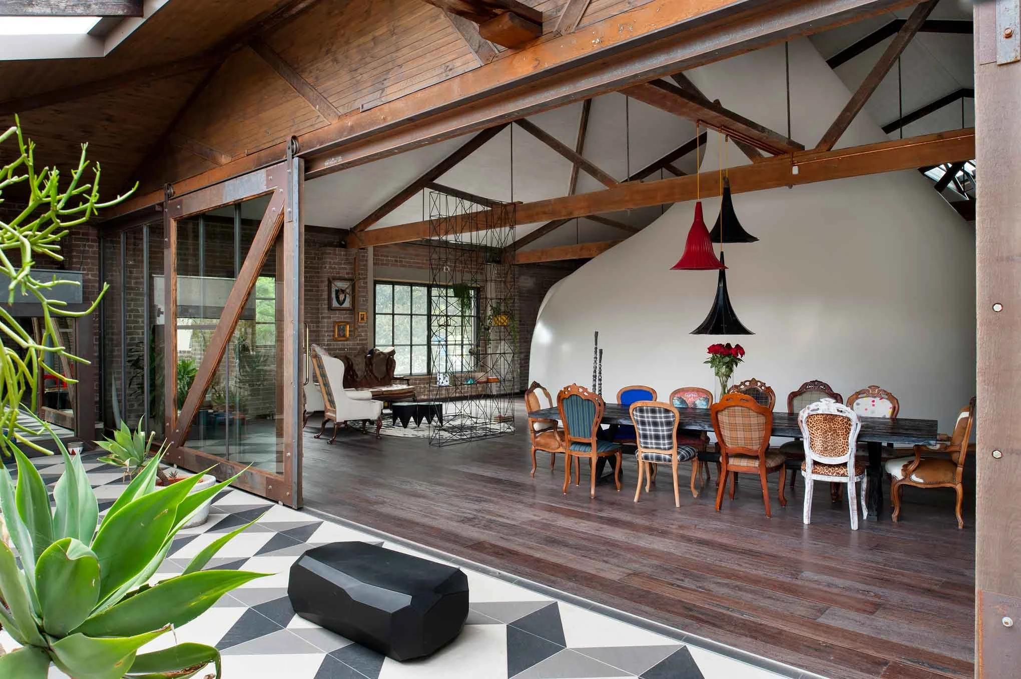 Outdoor patio and dining area at Herm Inn, residential warehouse by interior designer Kelly Ross