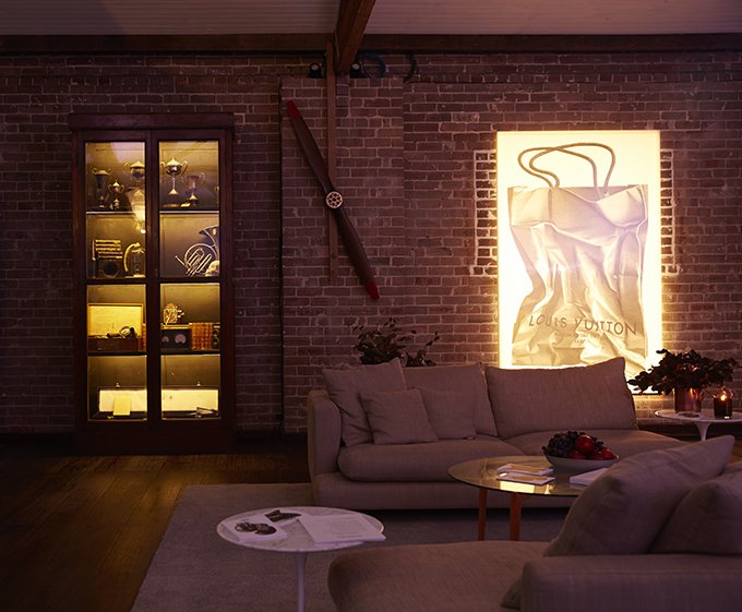 Backlit artwork in a living area in a residential warehouse by Kelly Ross