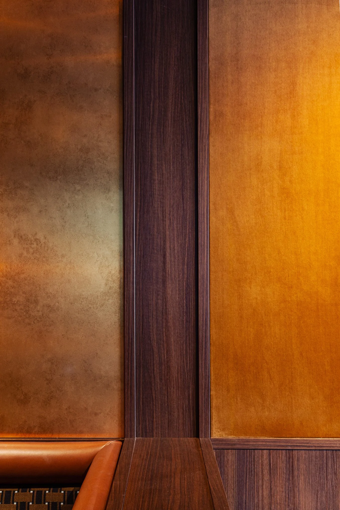 Dark timber and brass panelled wall at Legacy Lounge, Allianz Stadium