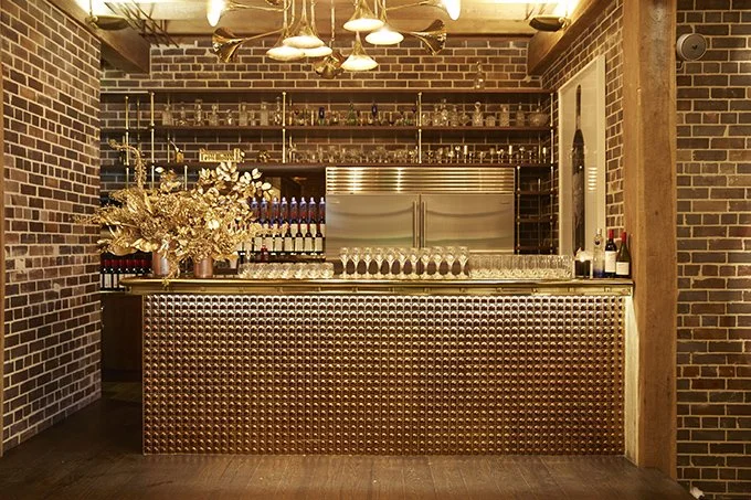 Exposed brick and lighting detail at a residential warehouse project designed by Kelly Ross