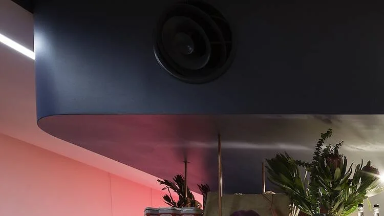 Bulkhead detail and pink lighting at a bar in Canberra. 