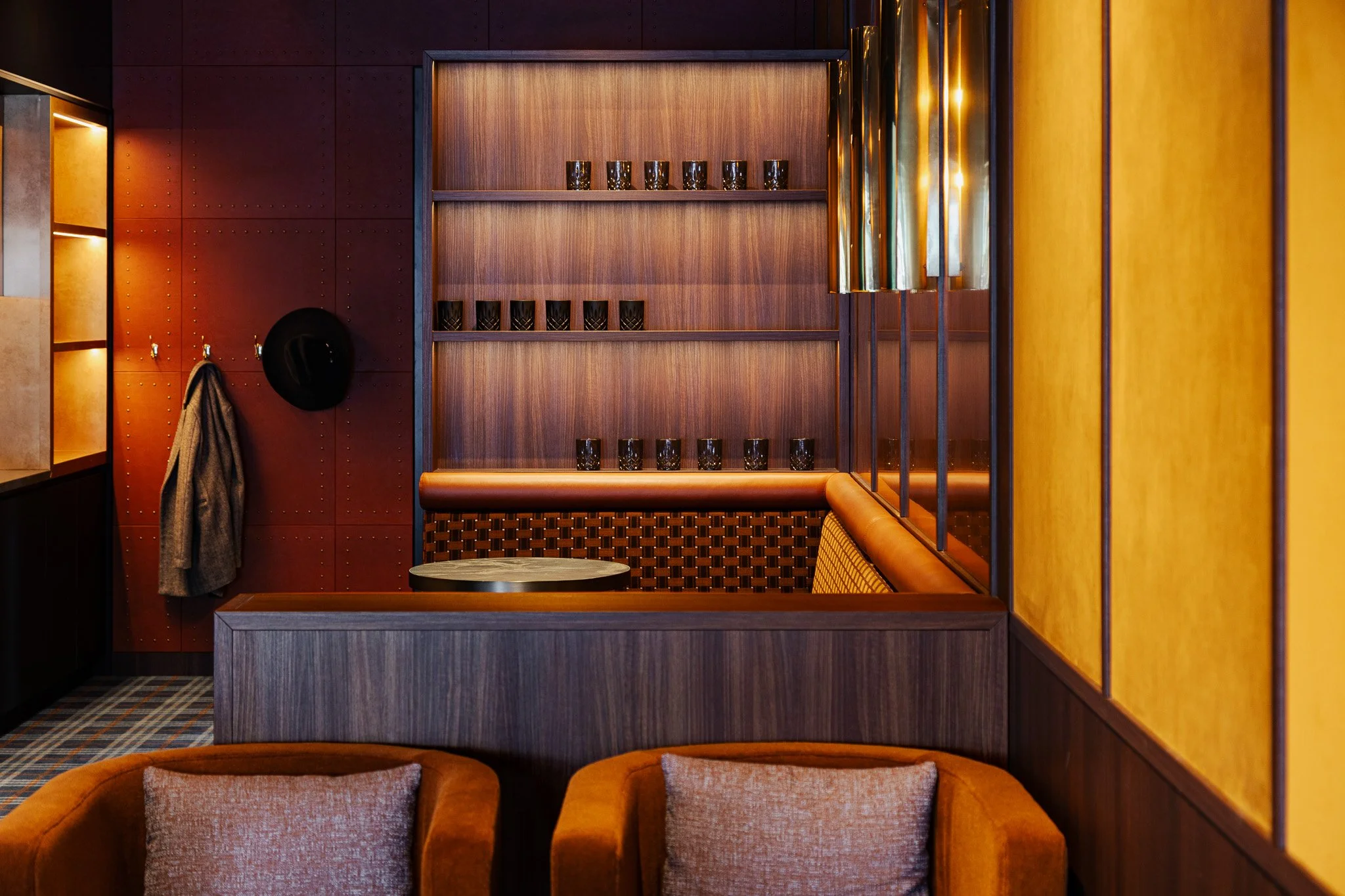 Layout of a private suite at Allianz Stadium with custom timber panelled joinery and an integrated kitchenette