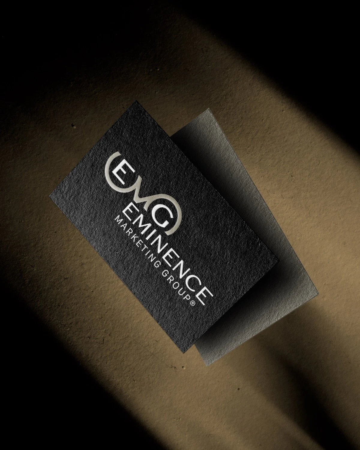 Logo design for Eminence Marketing Group. Initial concepts were broad and then narrowed down to a minimalist EMG lock up.