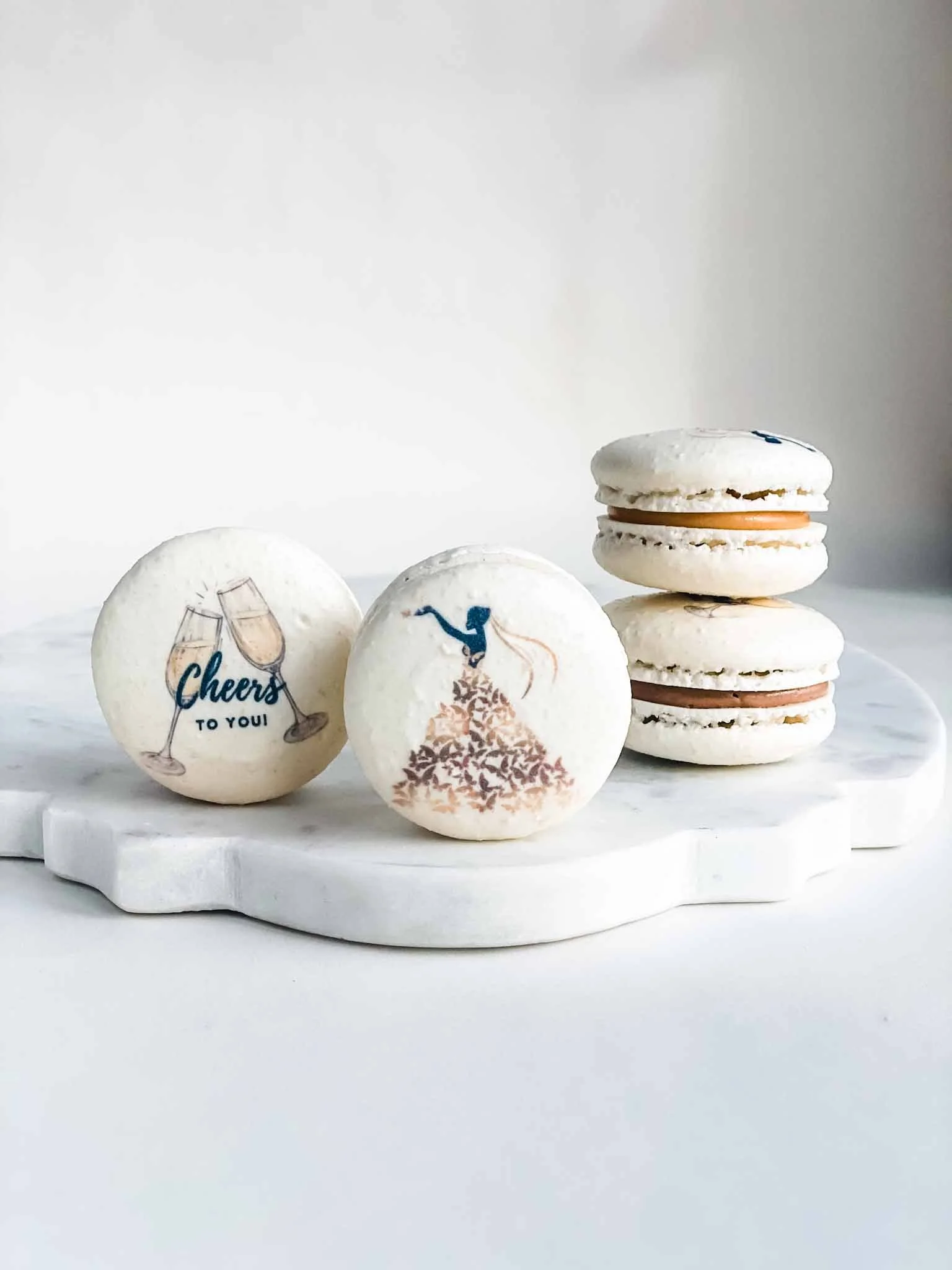 A Worthy Cookie bride and champagne macaron stack.jpg