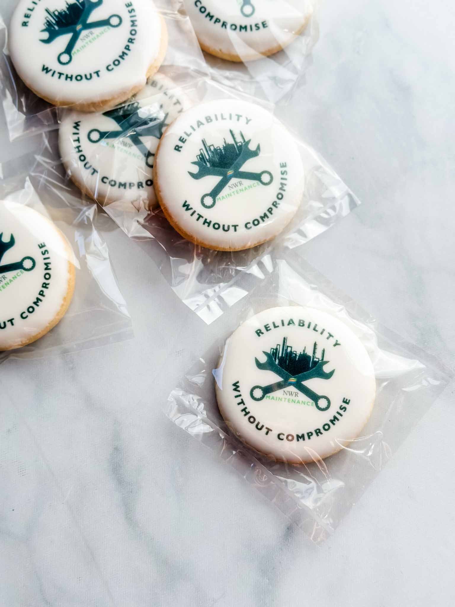 A Worthy Cookie large circle sugar cookies with construction logo.jpg
