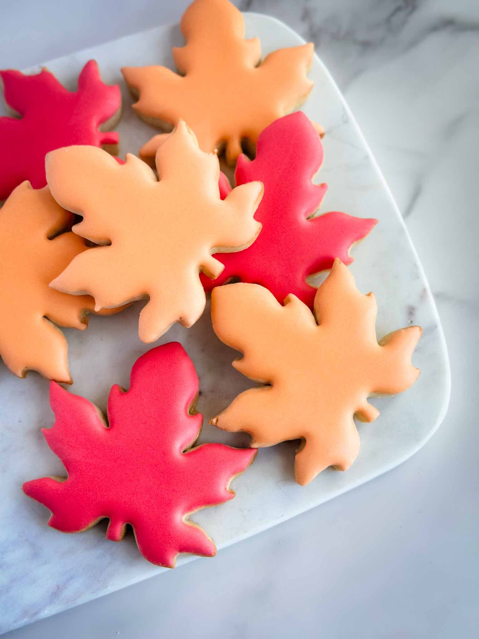 A Worthy Cookie Custom Sugar Cookies fall leaves in orange and red colours.jpg
