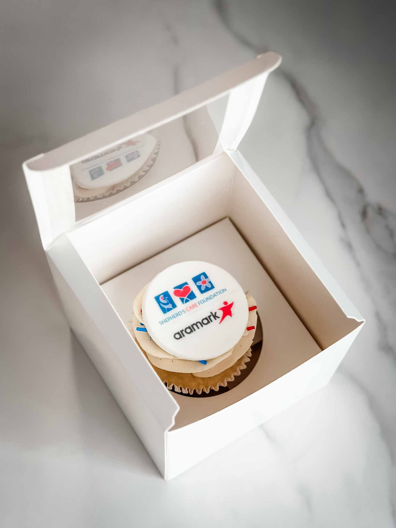 A Worthy Cookie individually boxed branded cupcake printed with two logos.jpg