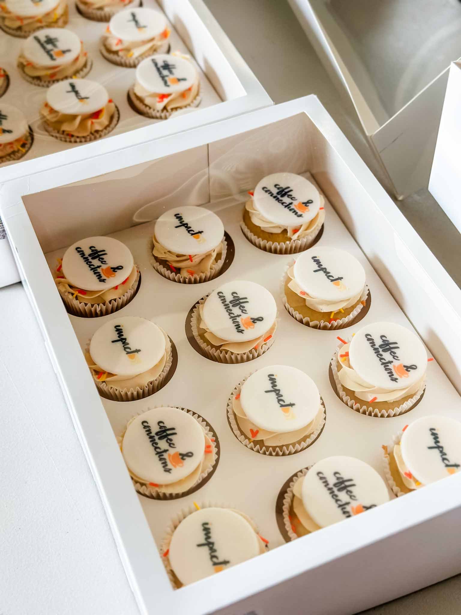 A Worthy Cookie branded cupcakes dozen per box two conference logos.jpg