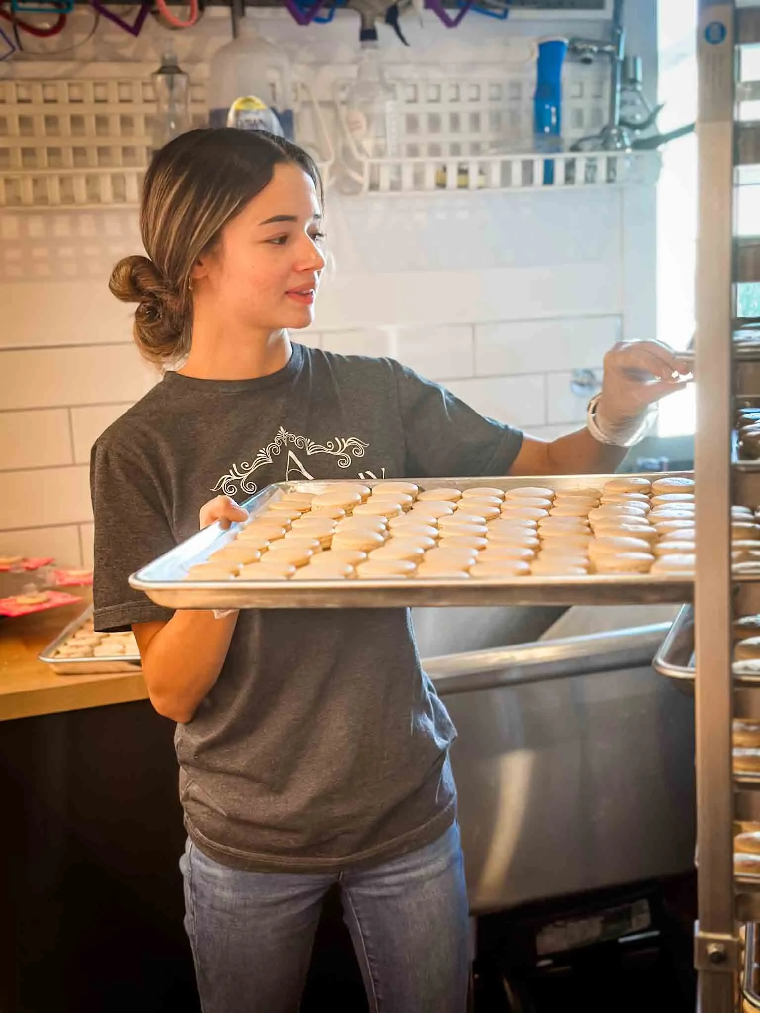 A Worthy Cookie izabel arranging macarons on tray.jpg