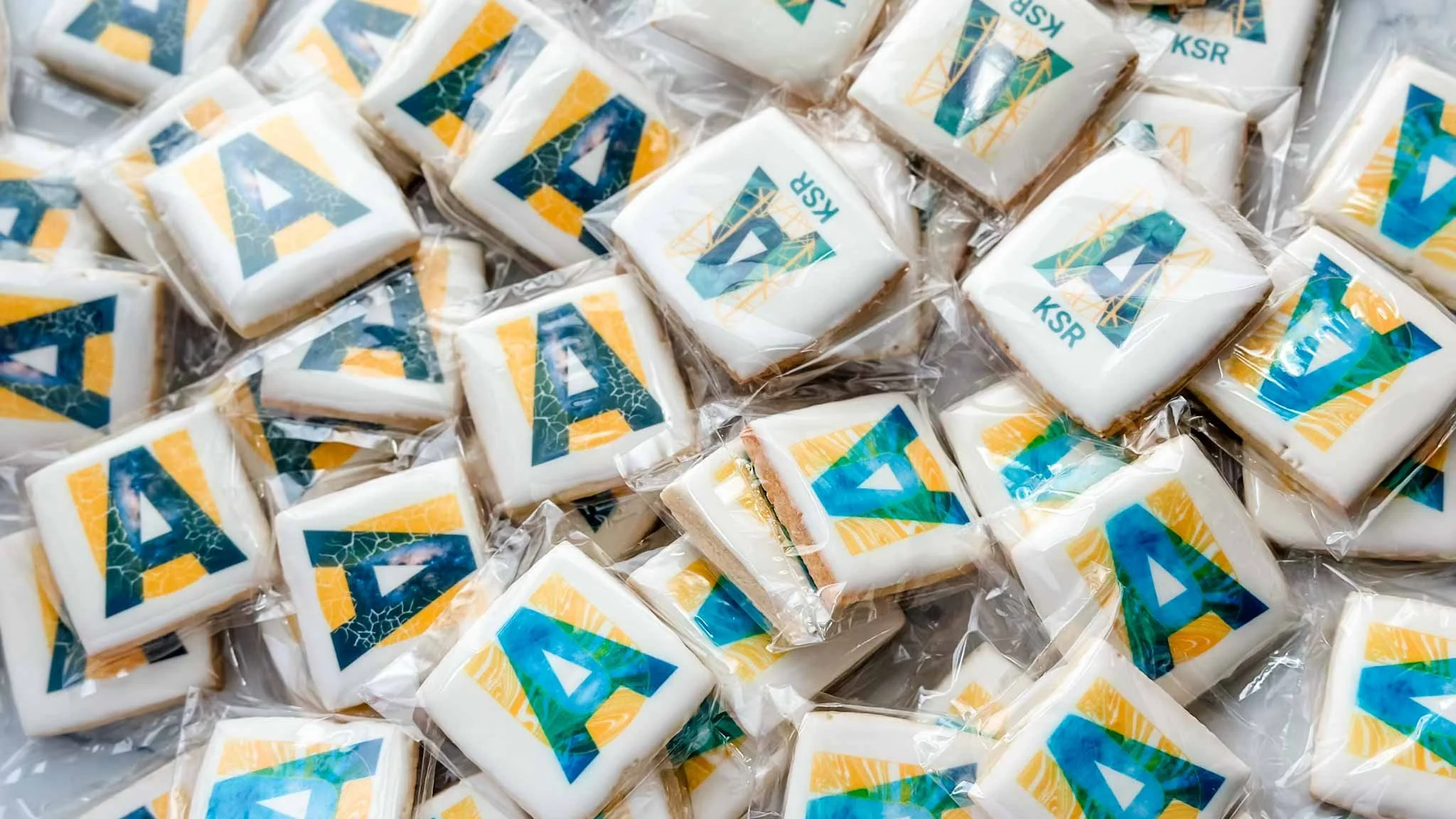 pile of square logo Sugar Cookies with different logos