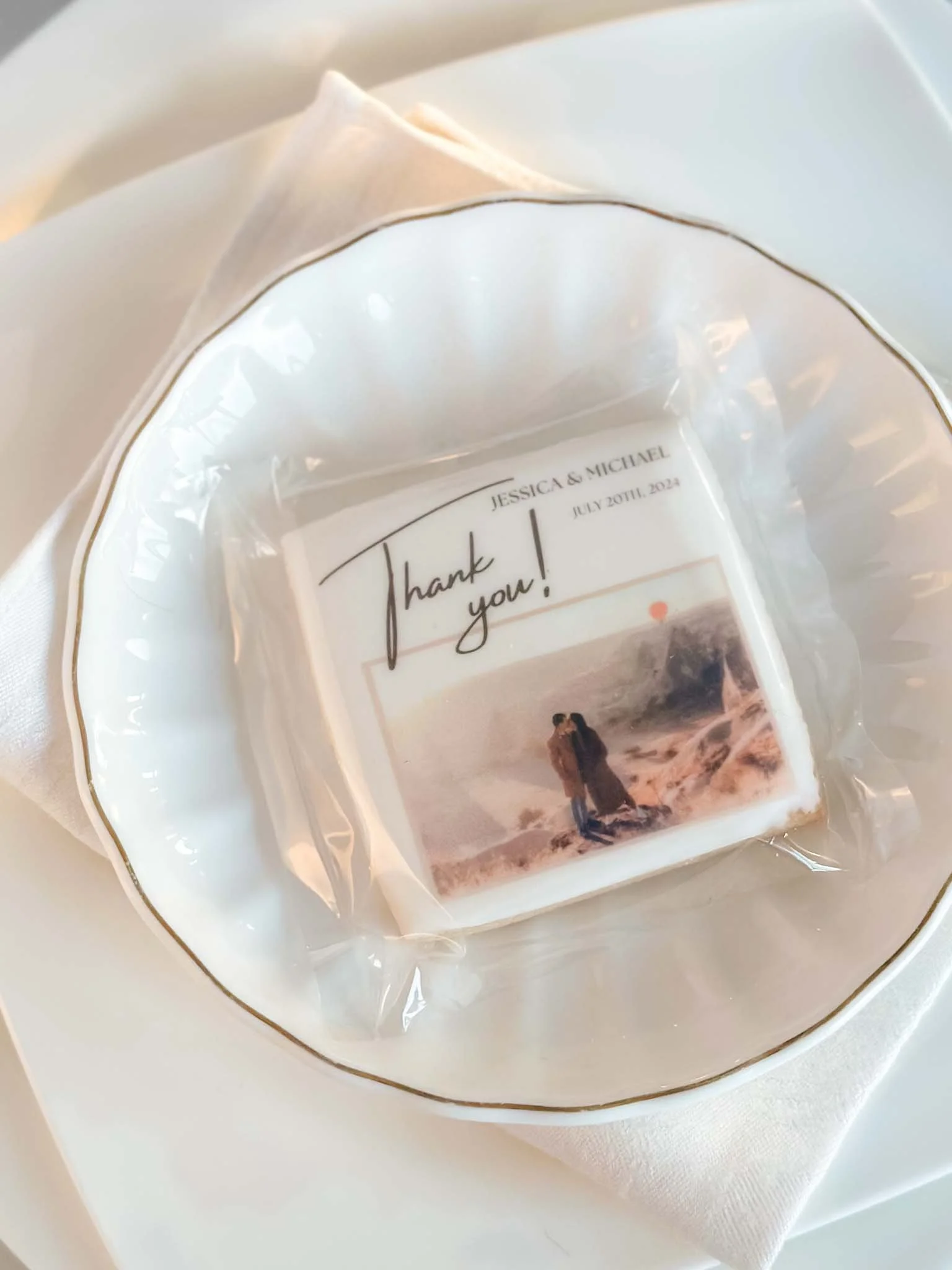 A Worthy Cookie square shaped XL wedding names and photo on top of plate setting.jpg